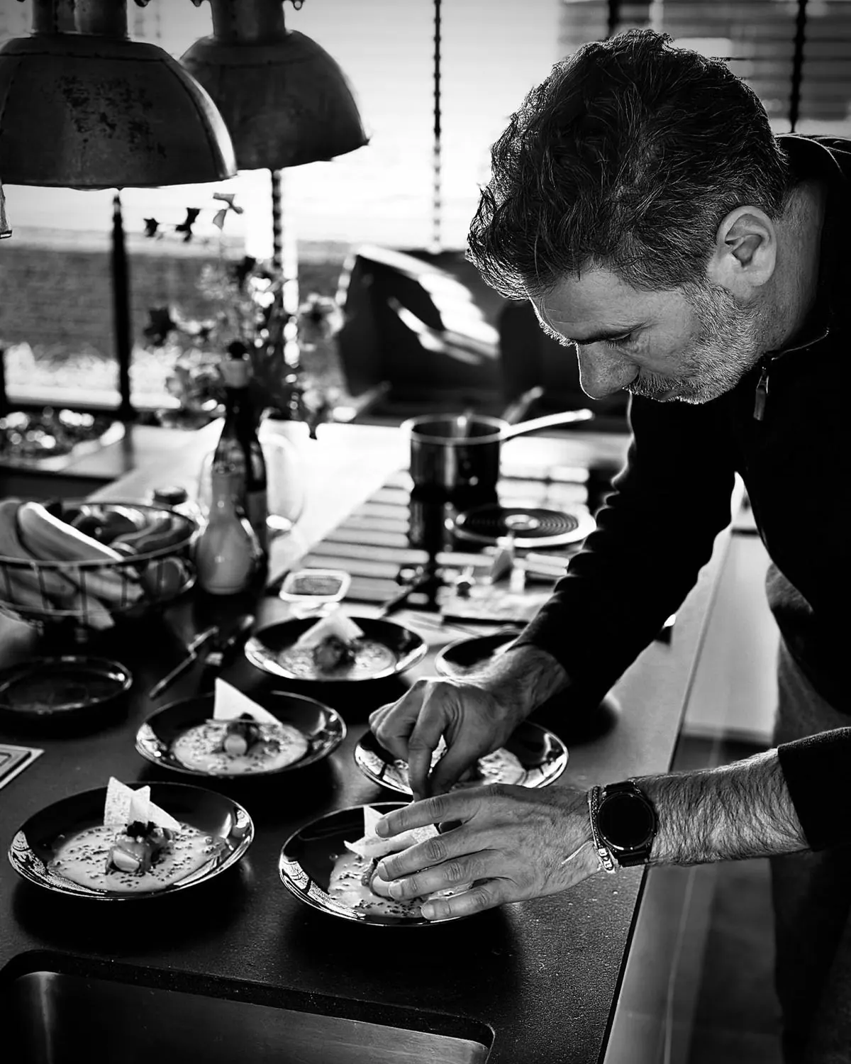 Teun Berkers plating dishes in a kitchen